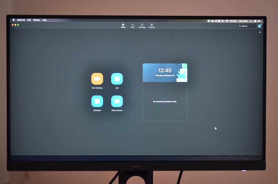 Contemporary stationary black rectangular monitor showing time on display with wires placed on brown background at convenient workplace in room